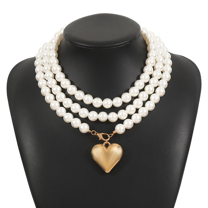 multi-strand pearl necklace with heart charm - NOELLEQ
